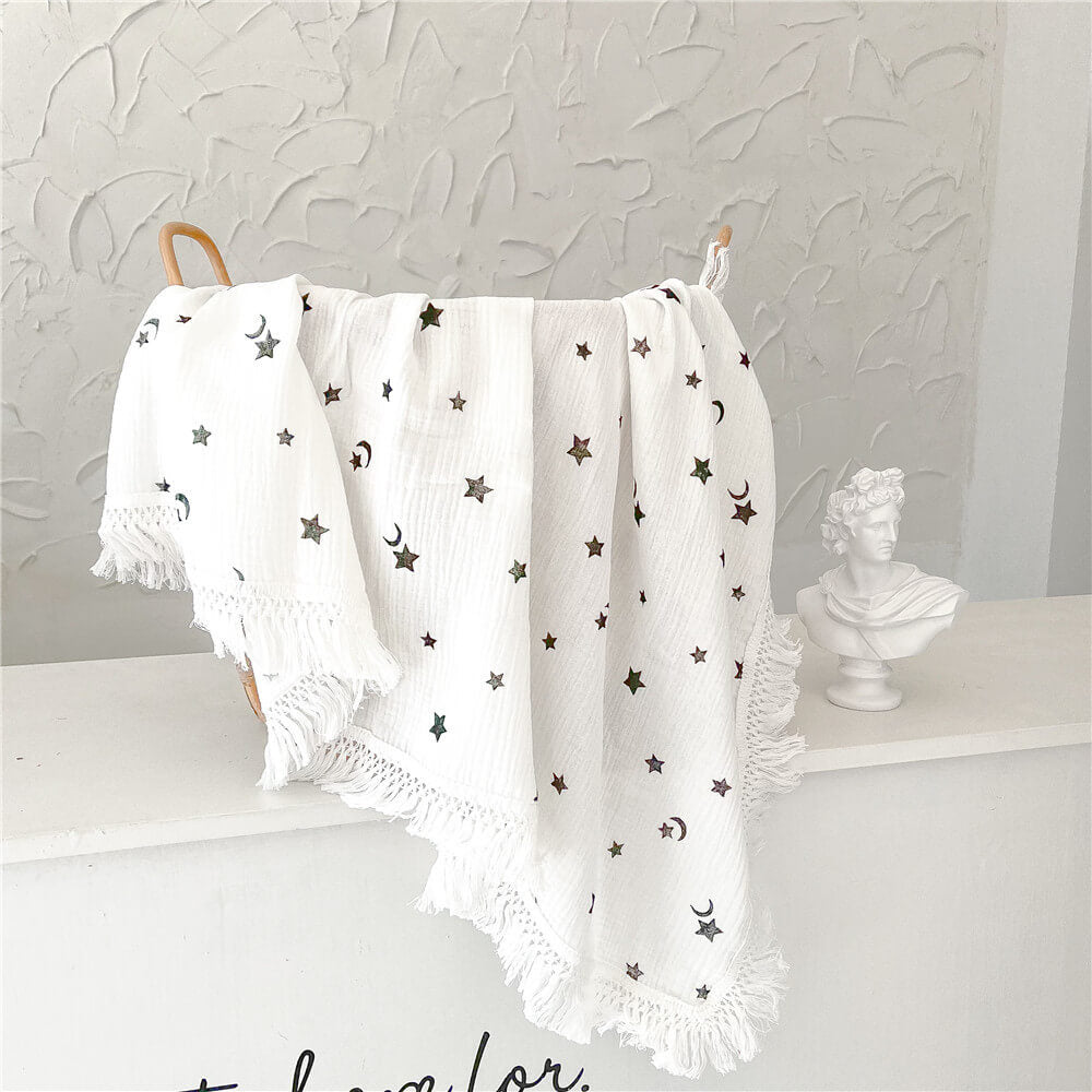 La couverture à pompons Swaddle (Imprimés multiples)