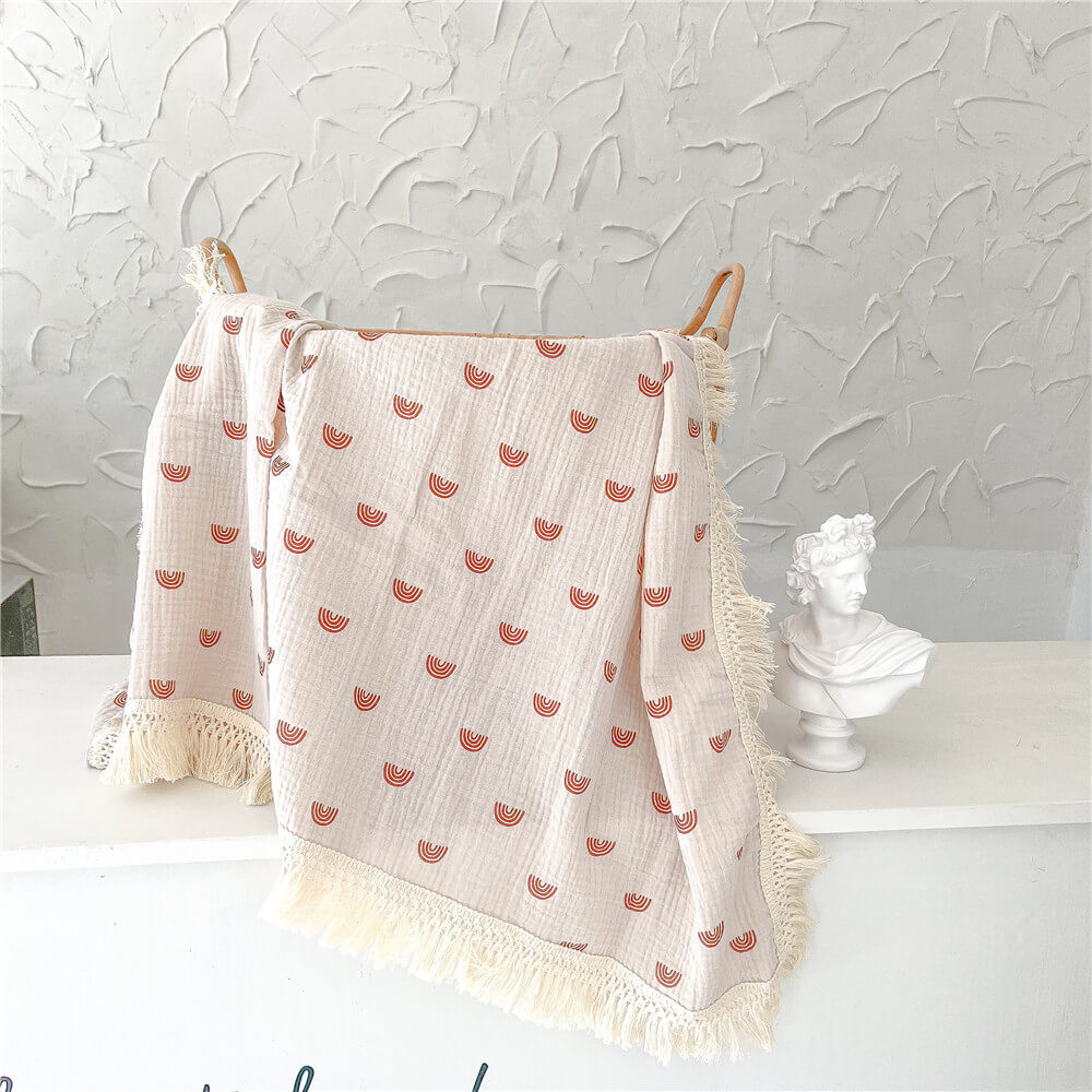 La couverture à pompons Swaddle (Imprimés multiples)