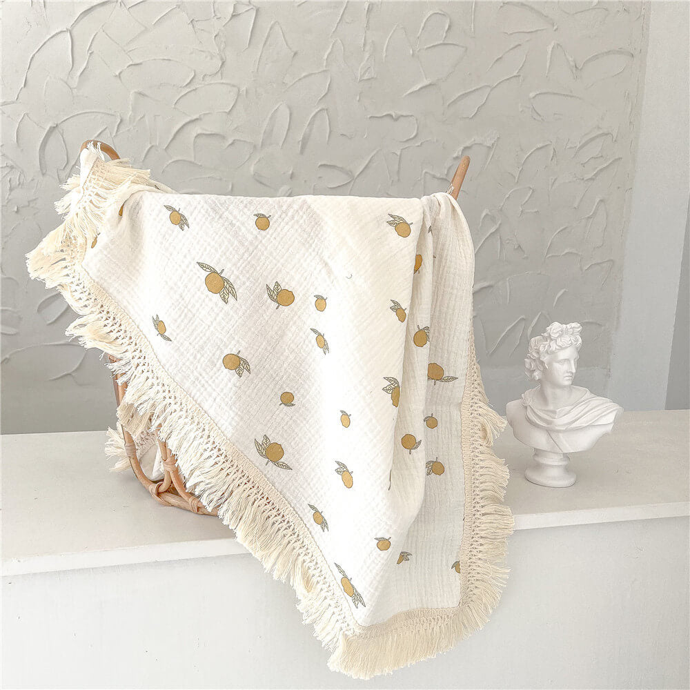 La couverture à pompons Swaddle (Imprimés multiples)