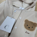 Sample Sale - 0-6m - Creme playsuit - top popper missing and 'Leo' in brown thread